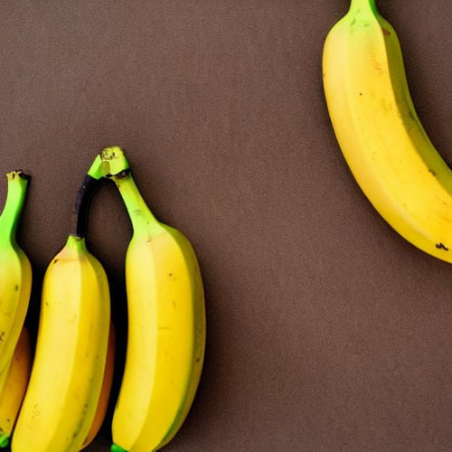 Fresh yellow bananas with green stems arranged on brown background